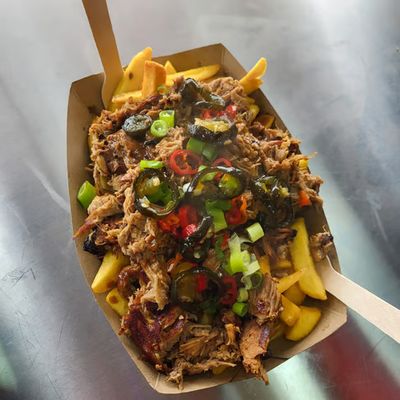 Loaded fries topped with pulled pork, jalapeños and spring onion